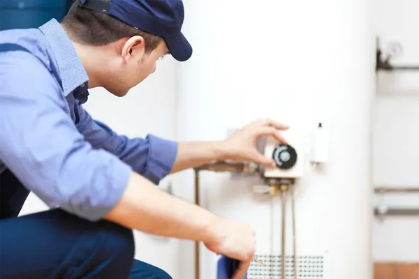 plumber repairing water heater